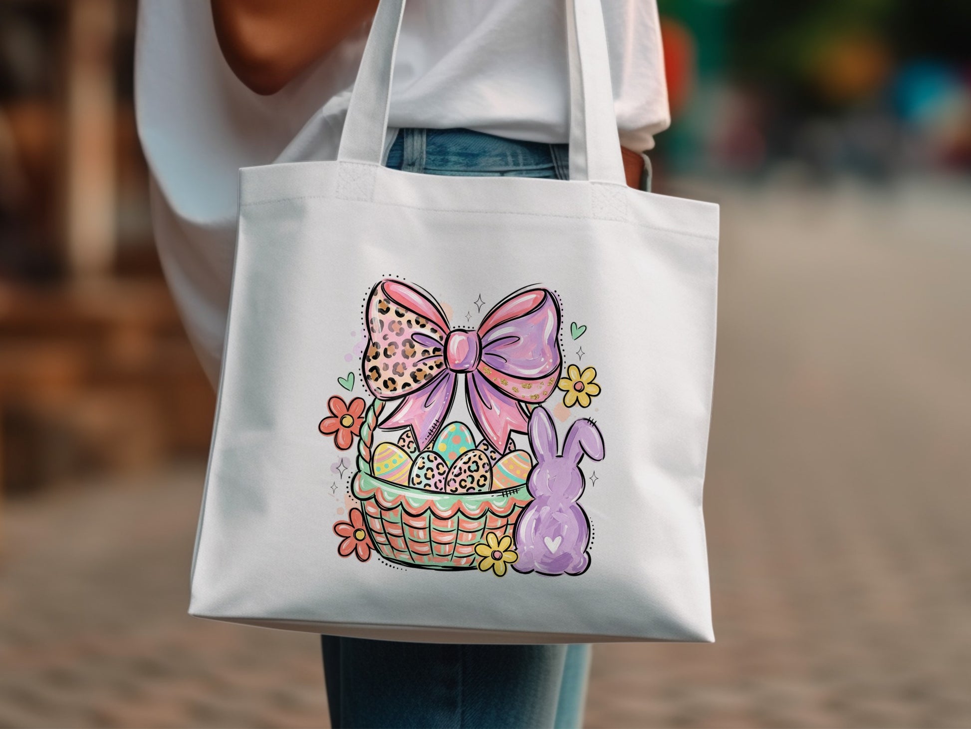 Easter basket with bunny, flowers, and pink bow design on white tote bag.