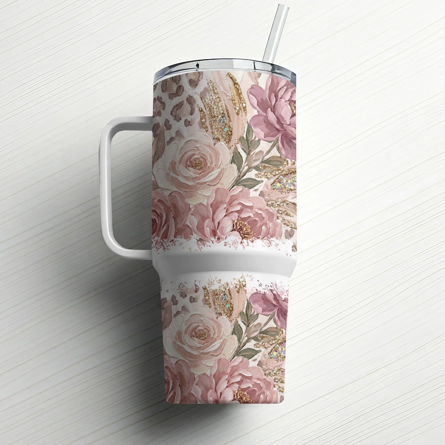 Floral and leopard print tumbler with a straw, on a white background.
