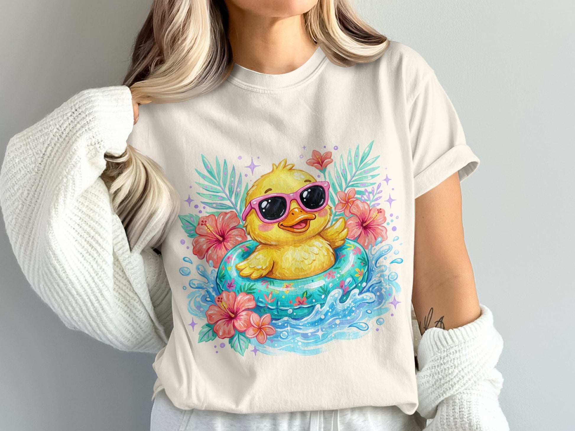 Cute yellow duck with sunglasses floats in a blue inner tube with flowers.