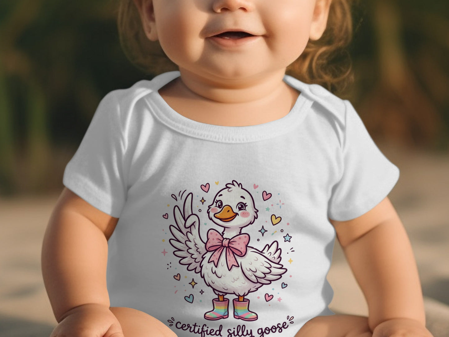 White baby onesie with a cartoon goose and text "certified silly goose."
