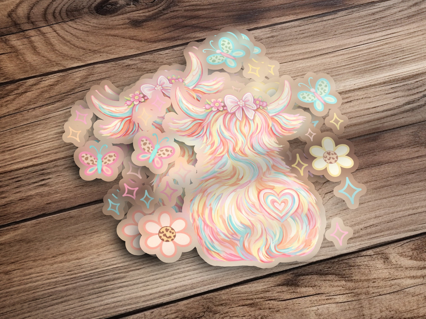 Pastel highland cow sticker with butterflies and flowers.