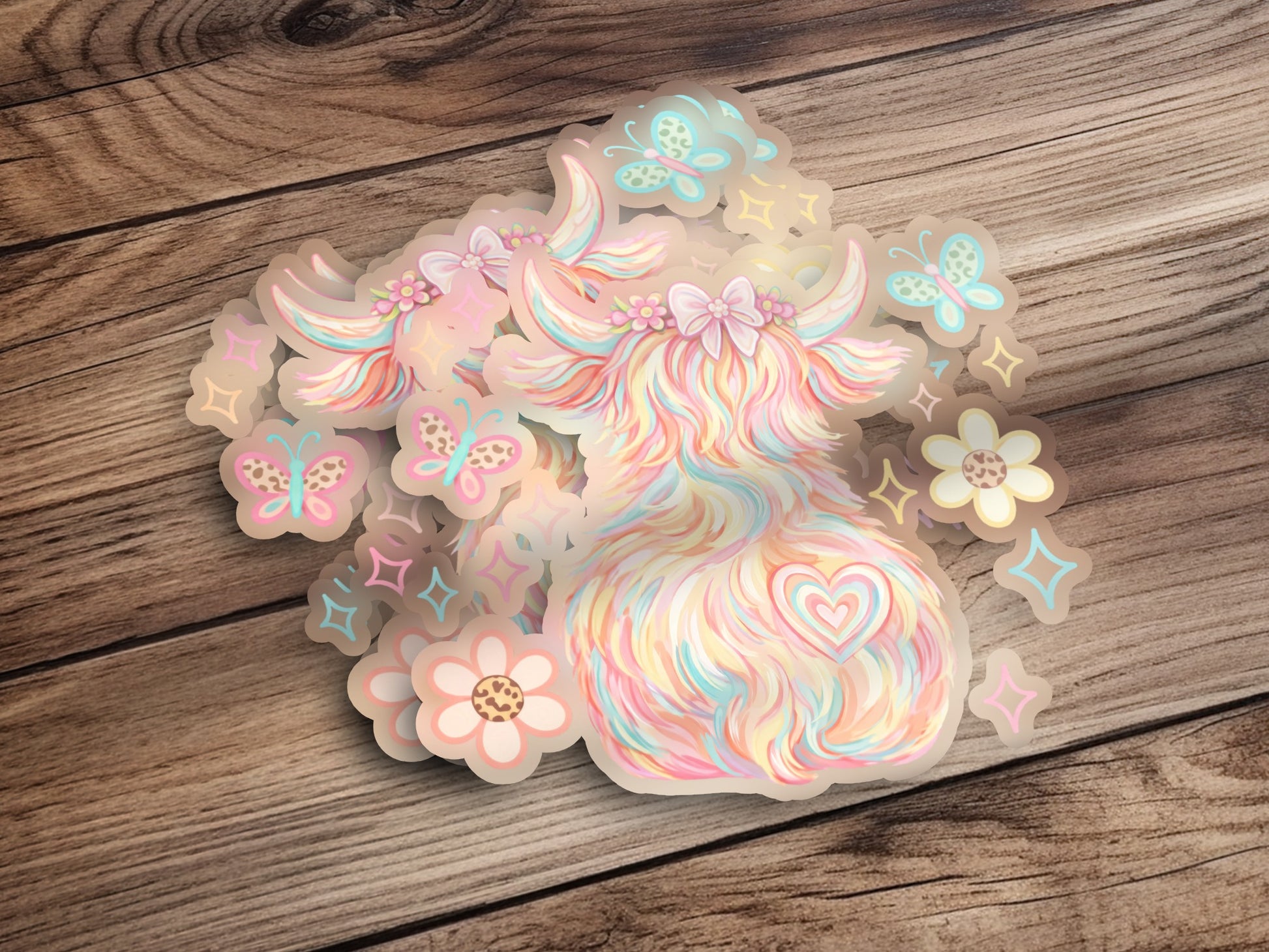 Pastel highland cow sticker with butterflies and flowers.