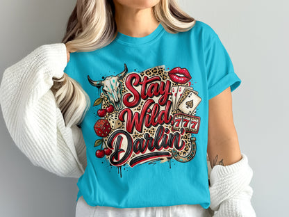 Skull, cherries, cards, dice, and horseshoe with "Stay Wild Darlin'" text.