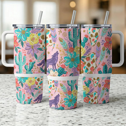 Three tumblers with a pastel floral, cactus, and wolf pattern.