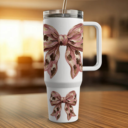 White tumbler with pink bows and gold glitter accents.
