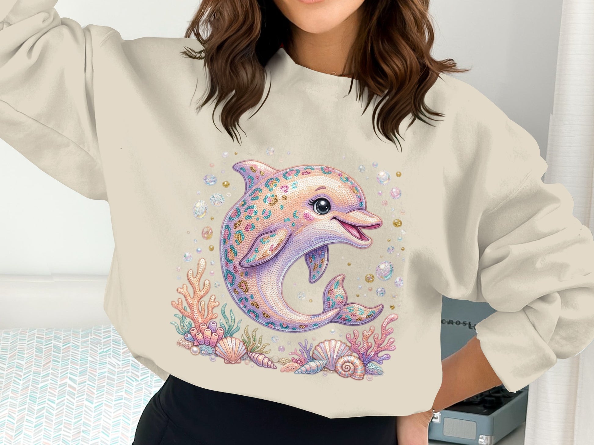 Crewneck sweatshirt with sequined dolphin graphic and seashells.