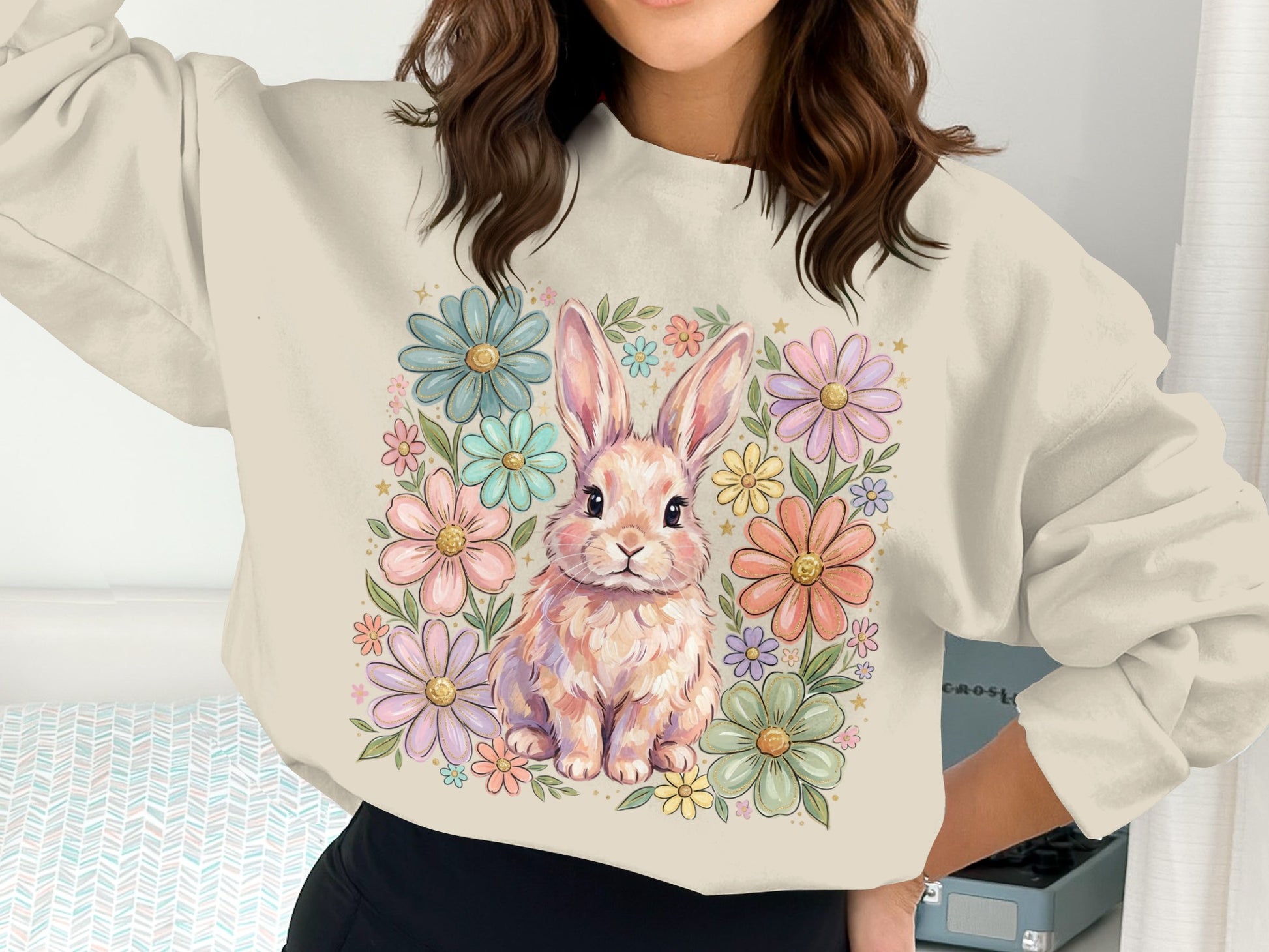 Pink bunny surrounded by colorful pastel flowers on a crewneck sweatshirt.