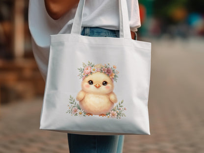 Fluffy yellow chick with floral crown on white tote bag.