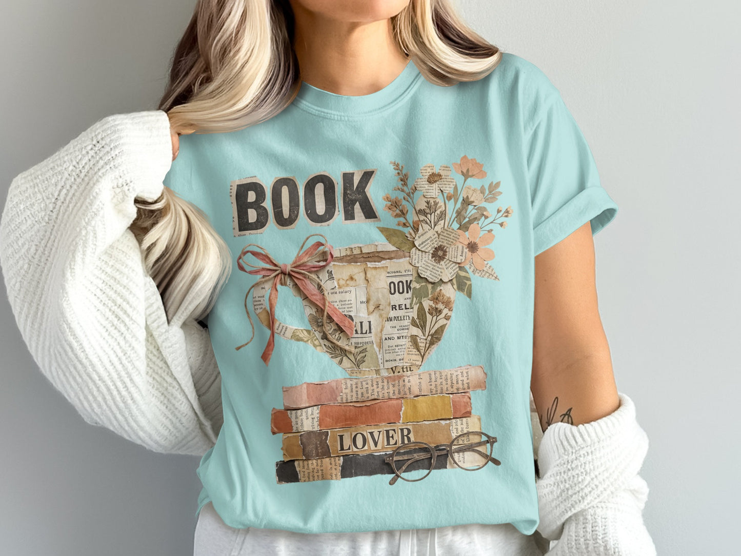 Light blue t-shirt with "BOOK LOVER" text and vintage book illustration.