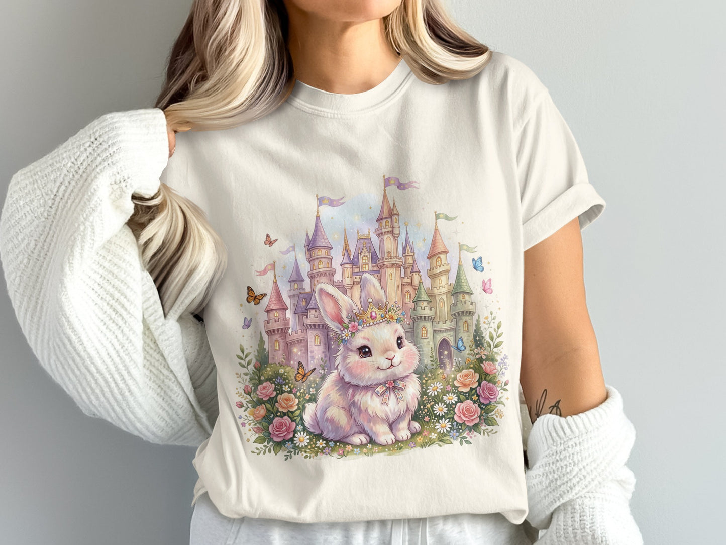 Fluffy bunny in crown sits before watercolor castle with flowers and butterflies.