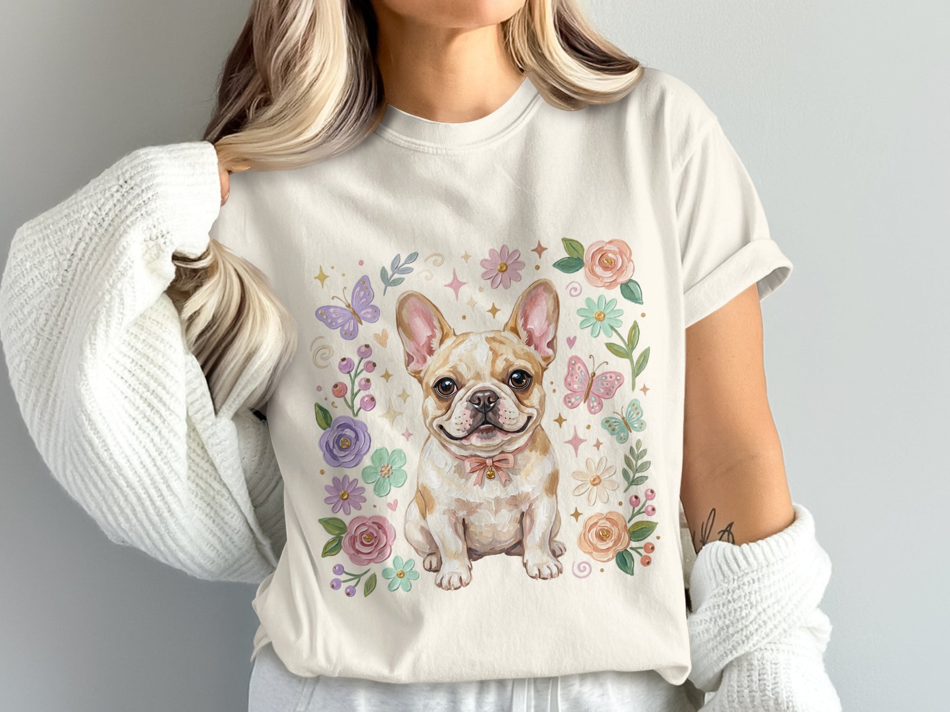 French bulldog wearing a pink bow, surrounded by flowers and butterflies.