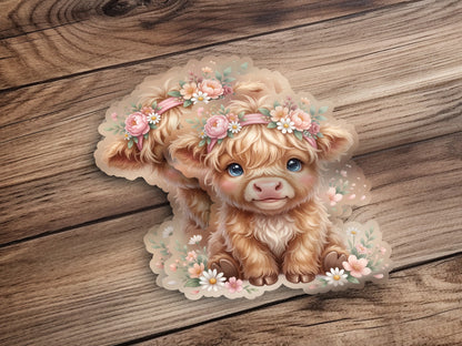 Fluffy calf with flower crown on wooden background.