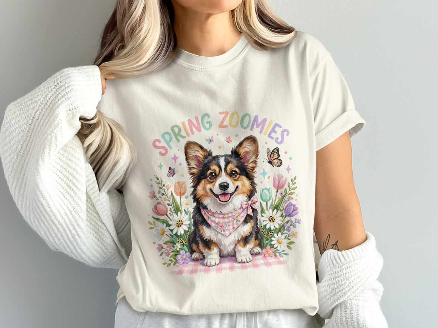 T-shirt with a happy corgi wearing a bandana and surrounded by flowers.