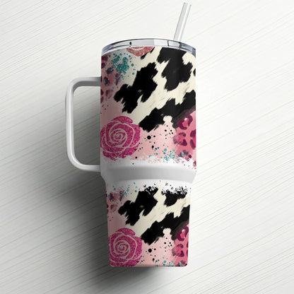 White tumbler with cow print, pink roses, and leopard spots.