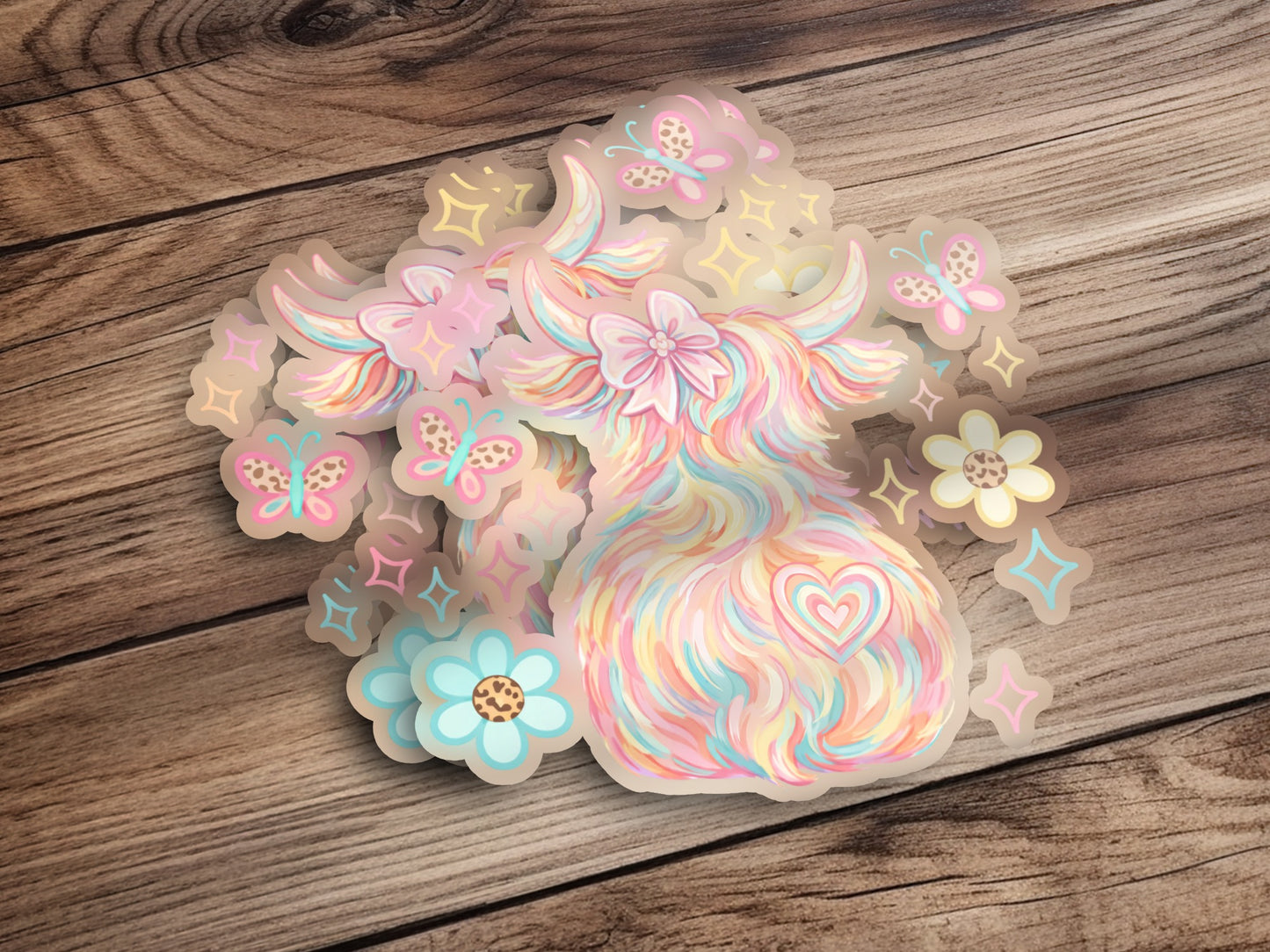 Pastel highland cow sticker with butterflies and flowers.
