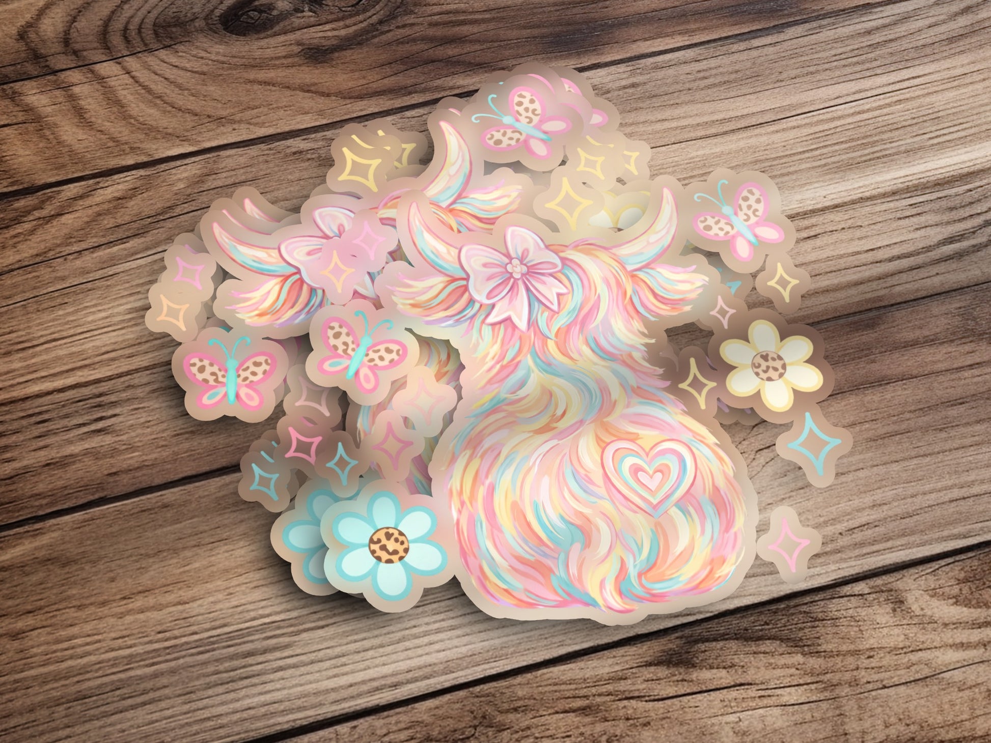 Pastel highland cow sticker with butterflies and flowers.