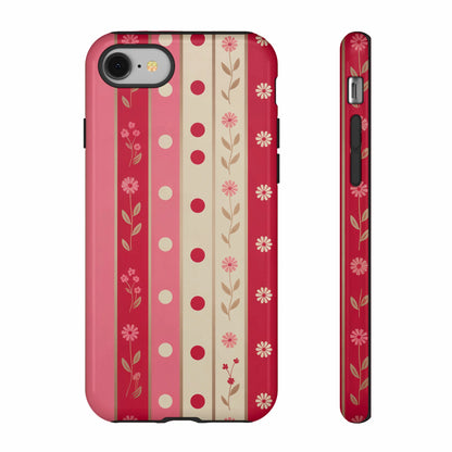 Pink striped phone case with flowers and polka dots, front and side view.