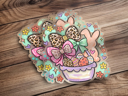 Easter basket with eggs, bows, and bunnies, outlined in pastel colors.