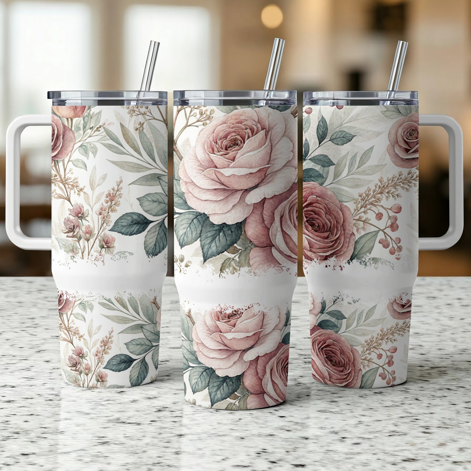 Three tumblers with a floral pattern of pink roses and greenery.