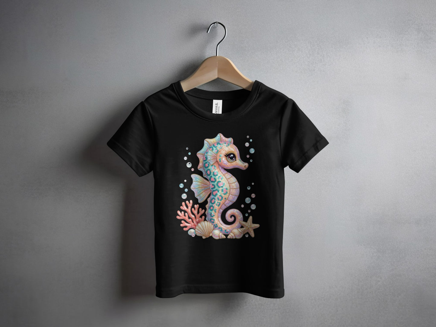 Black t-shirt with a colorful cartoon seahorse, starfish, and coral reef graphic.