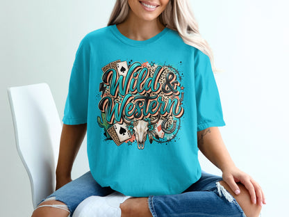 Teal t-shirt with "Wild & Western" design featuring playing cards, skull, and cactus.