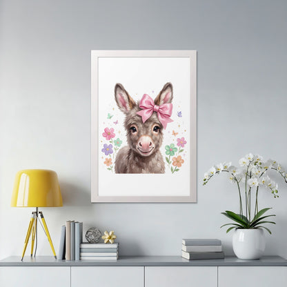 Framed artwork of a smiling donkey with a pink bow and flowers.