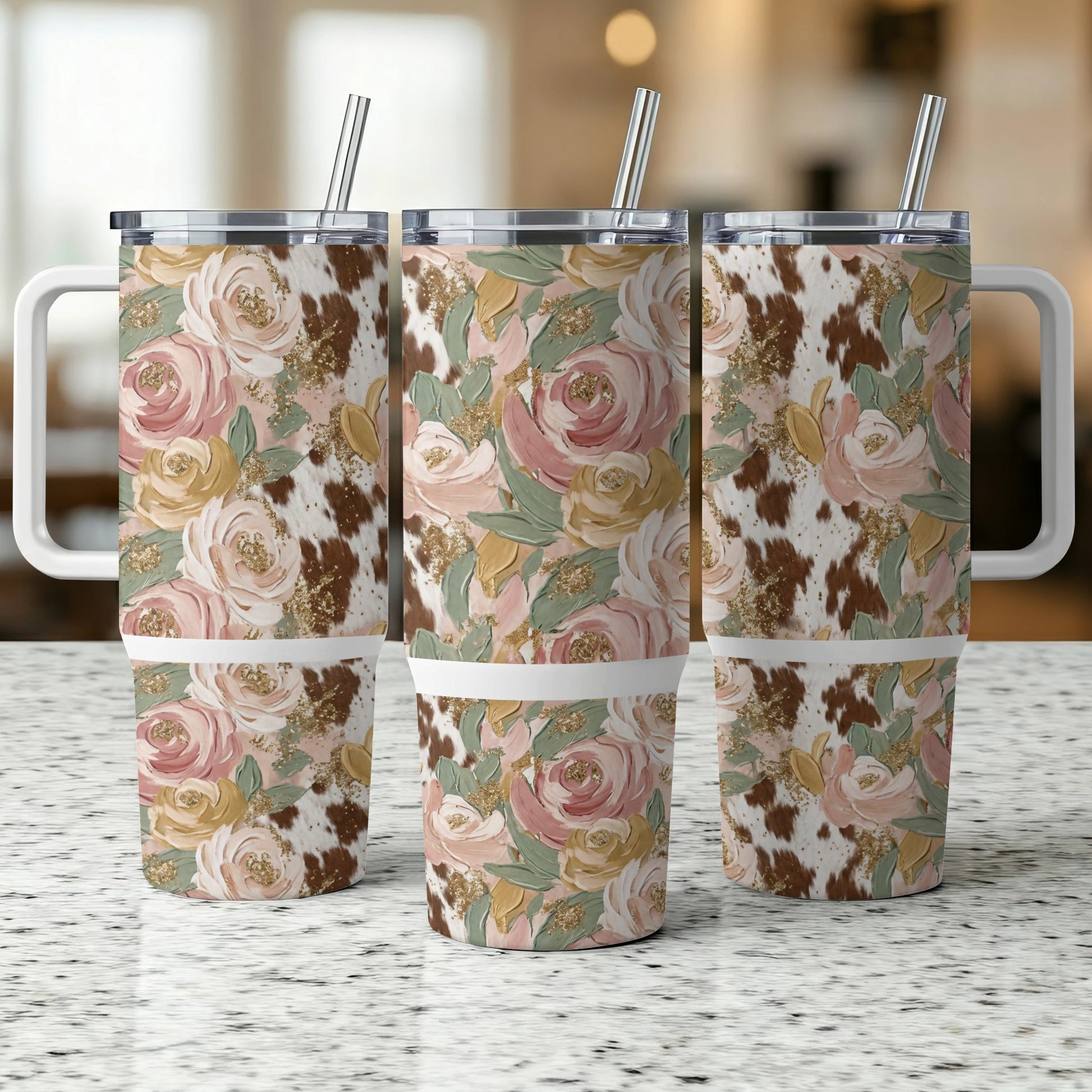 Three tumblers with floral and cowhide print, set against a blurred background.