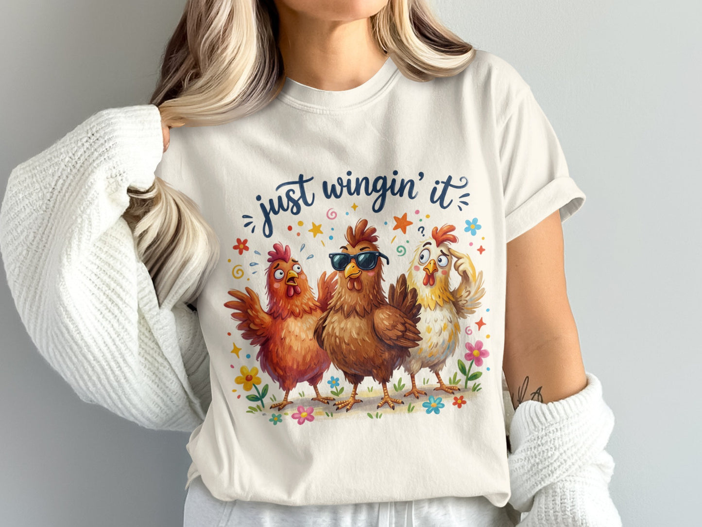 Three cartoon chickens wearing sunglasses, with text "just wingin' it".