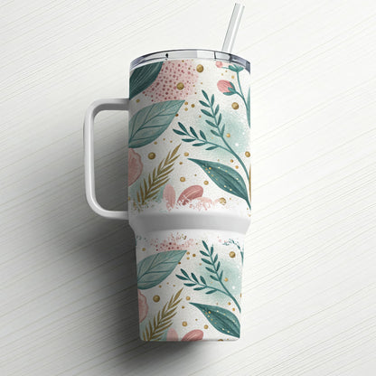 White tumbler with handle and straw, decorated with pink and green floral pattern.