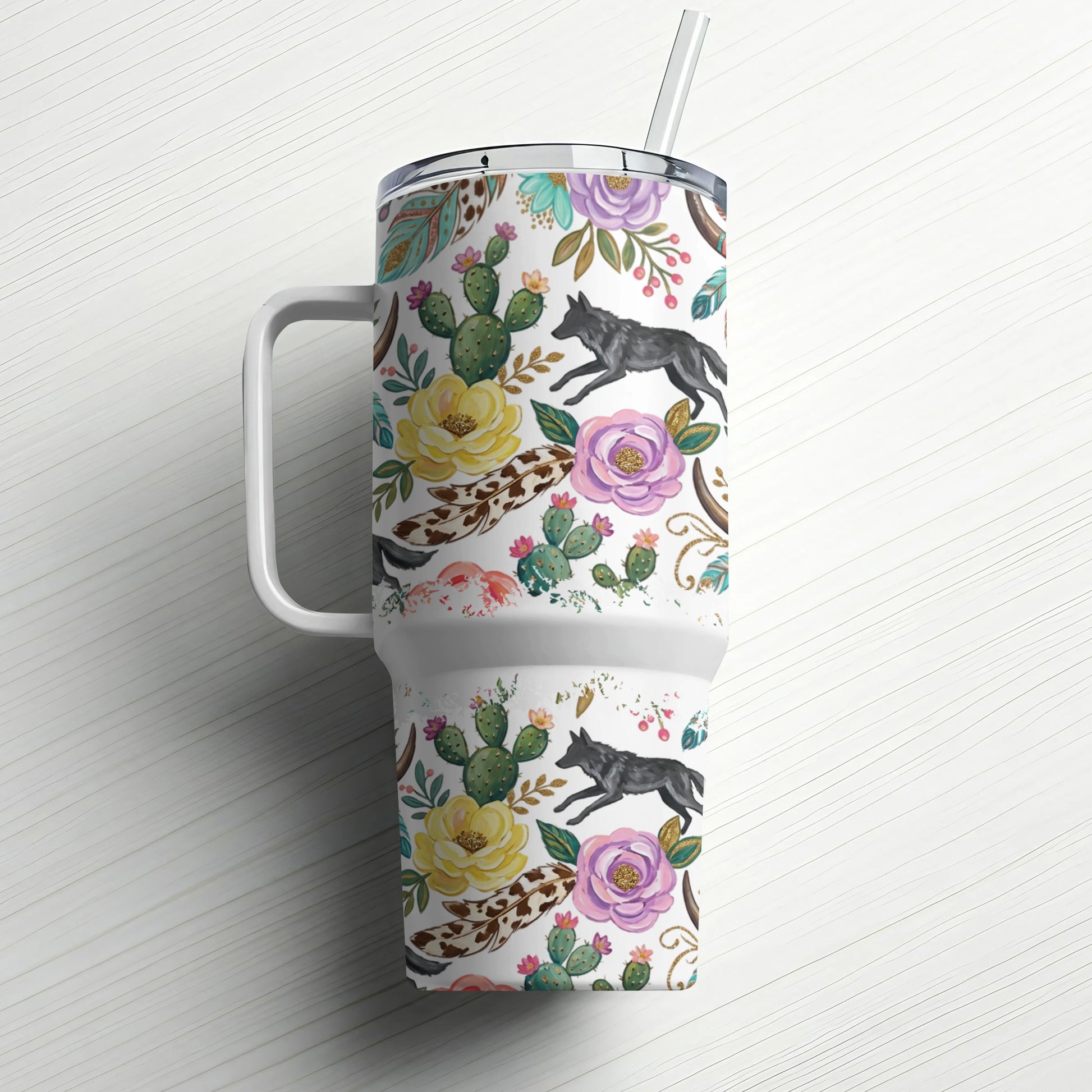 White tumbler with western floral and wolf pattern, featuring a handle and straw.