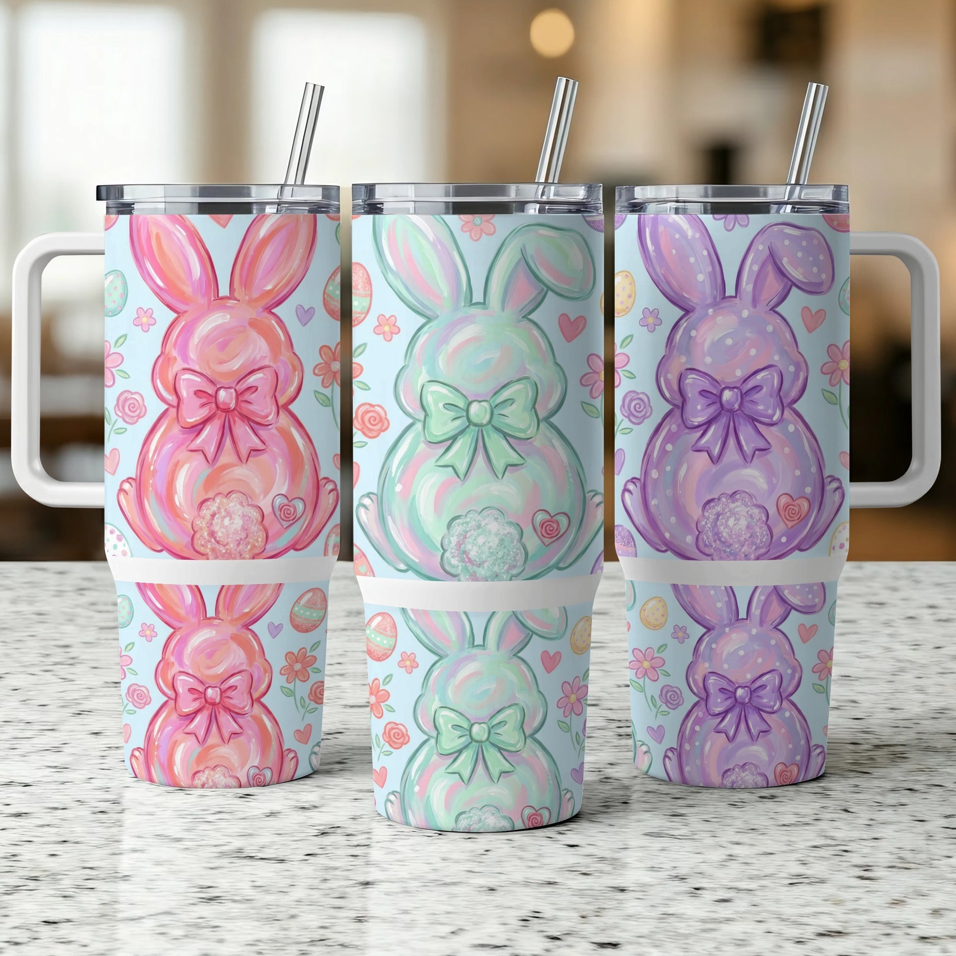 Three Easter bunny tumblers with bows, hearts, and flowers.
