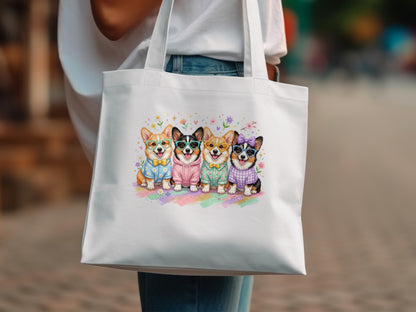 Four corgi dogs wearing sweaters and glasses on a white tote bag.
