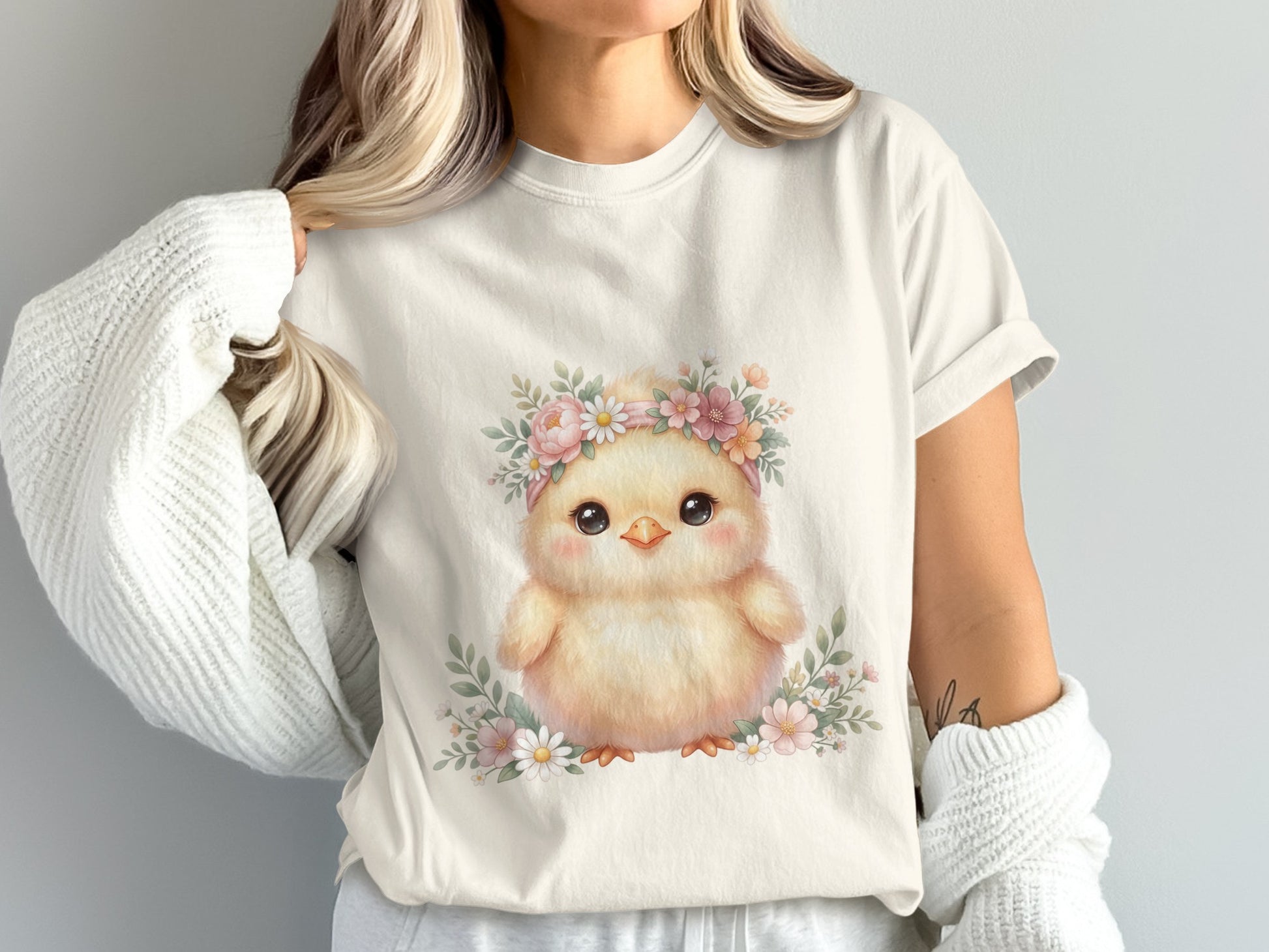 Yellow chick with floral crown on light cream t-shirt.