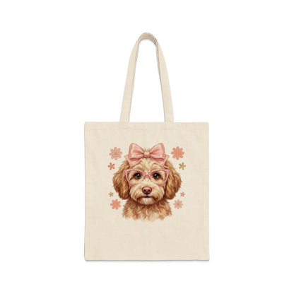 Canvas tote bag featuring a doodle dog wearing glasses and a pink bow.