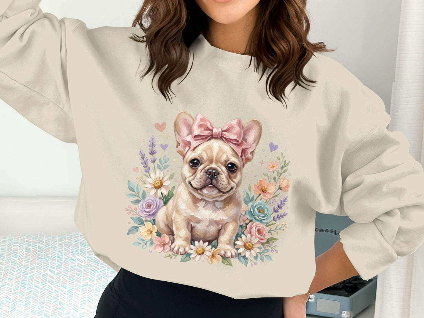 French bulldog wearing a pink bow with flowers.