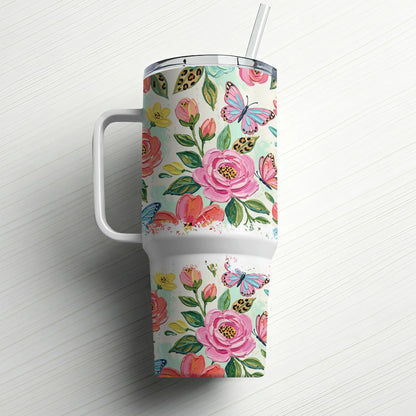 Floral tumbler with handle and straw, featuring pink roses and blue butterflies.