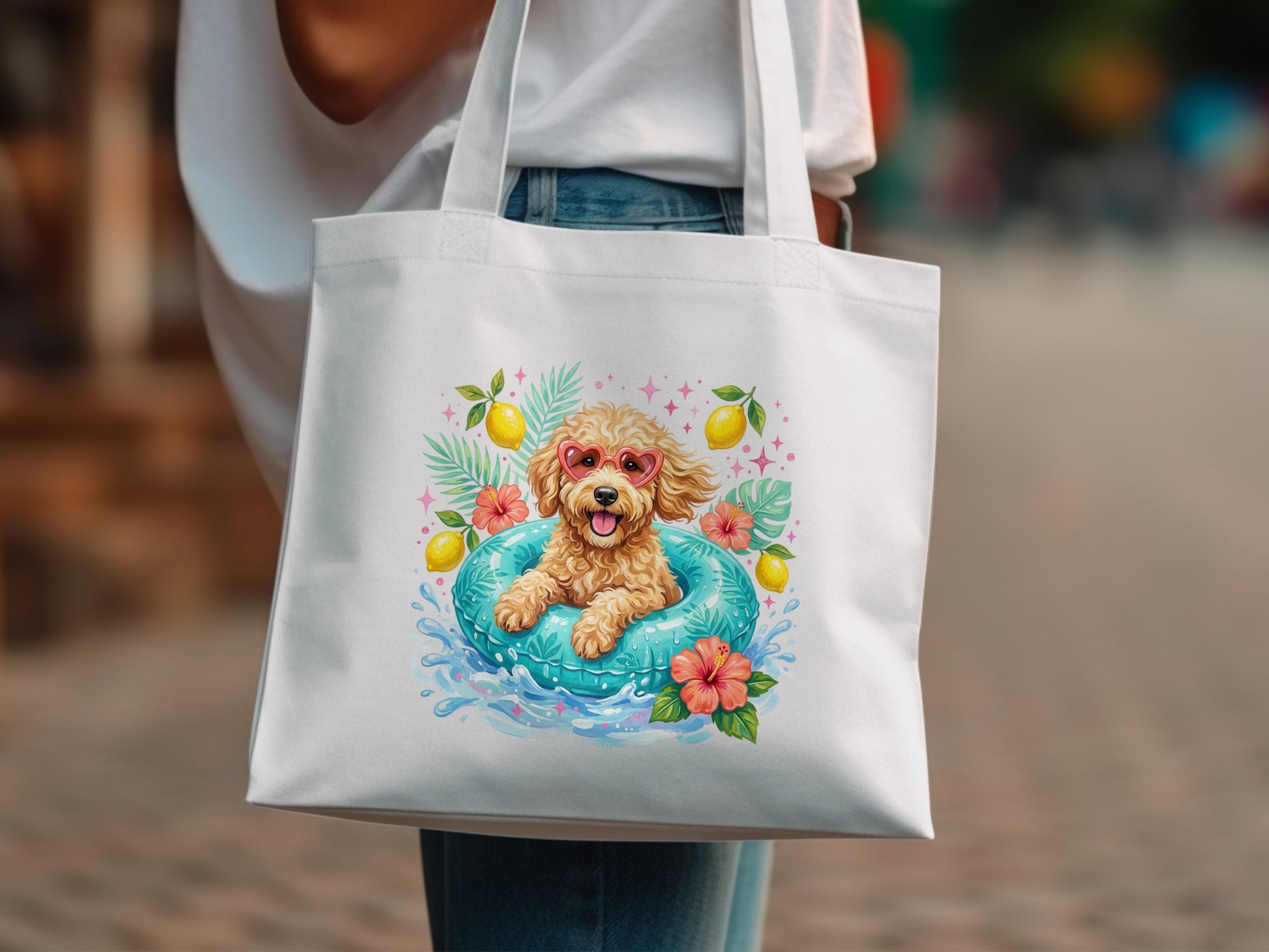 White tote bag with a poodle in a pool float and fruit.