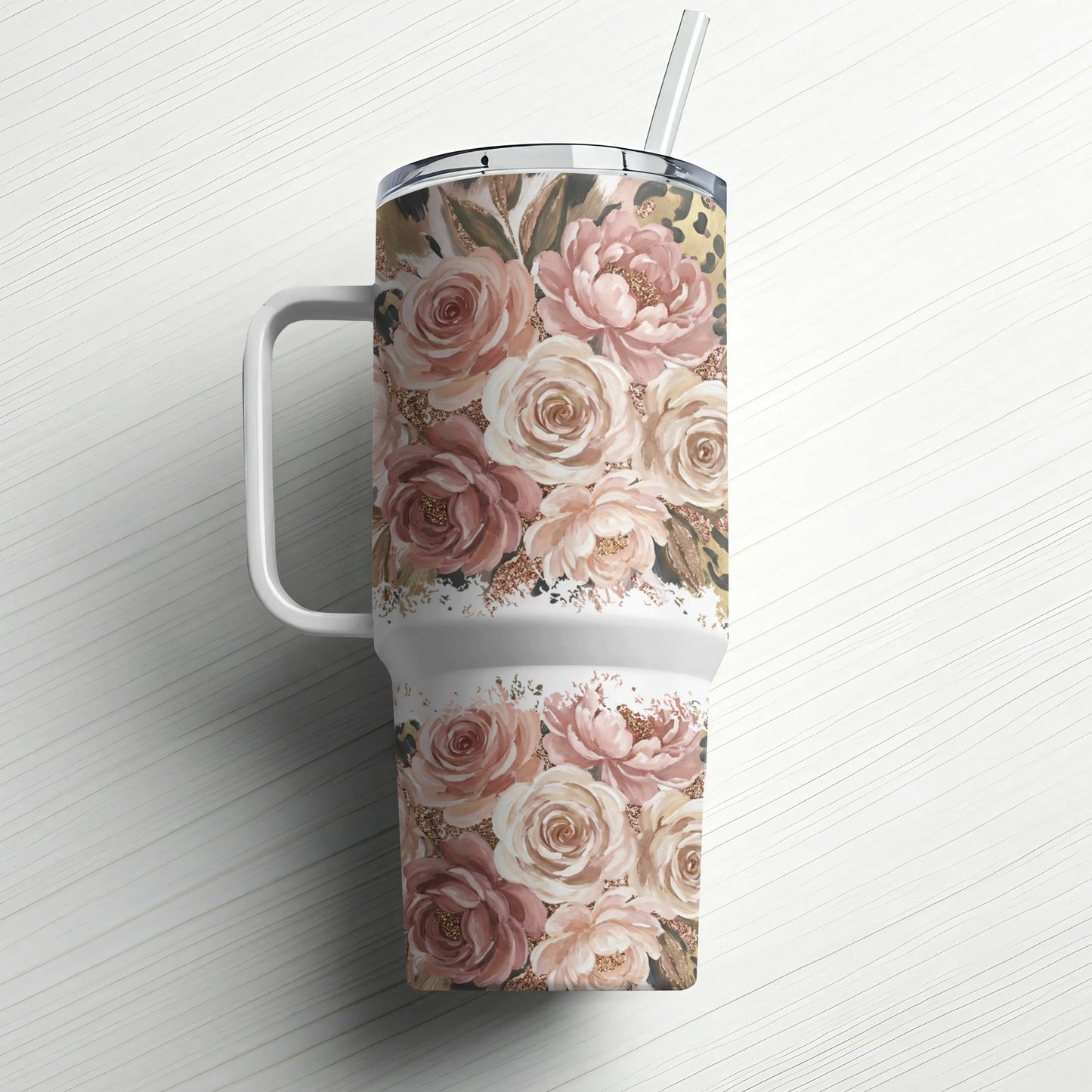 Large tumbler with floral and leopard print design and straw.
