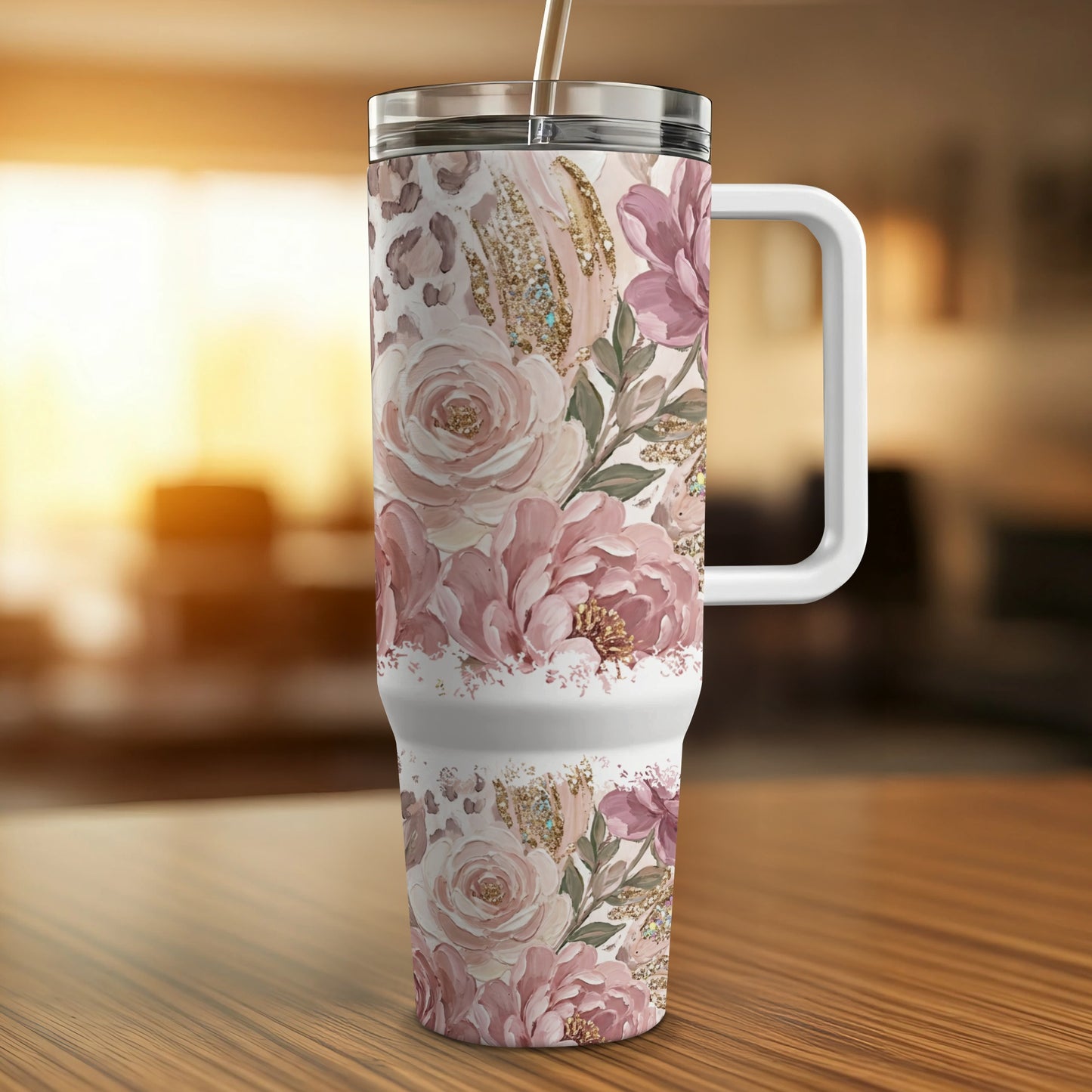 Floral and leopard print tumbler with handle on a wooden table.