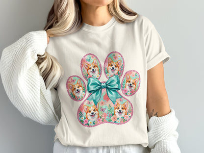 Paw print with corgis, flowers, butterflies, and a teal bow.