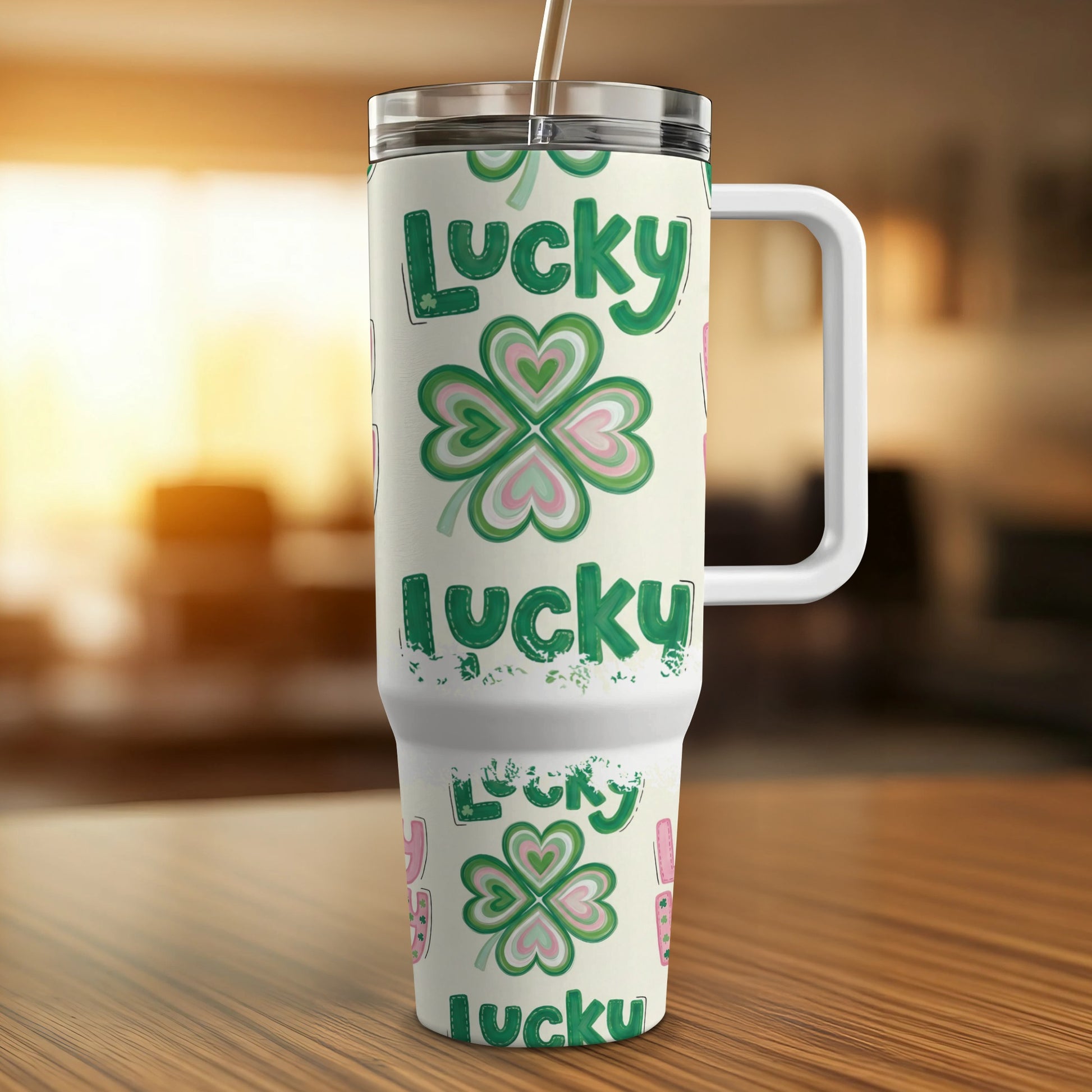 White tumbler with green clover and "lucky" pattern, for hot or cold drinks.