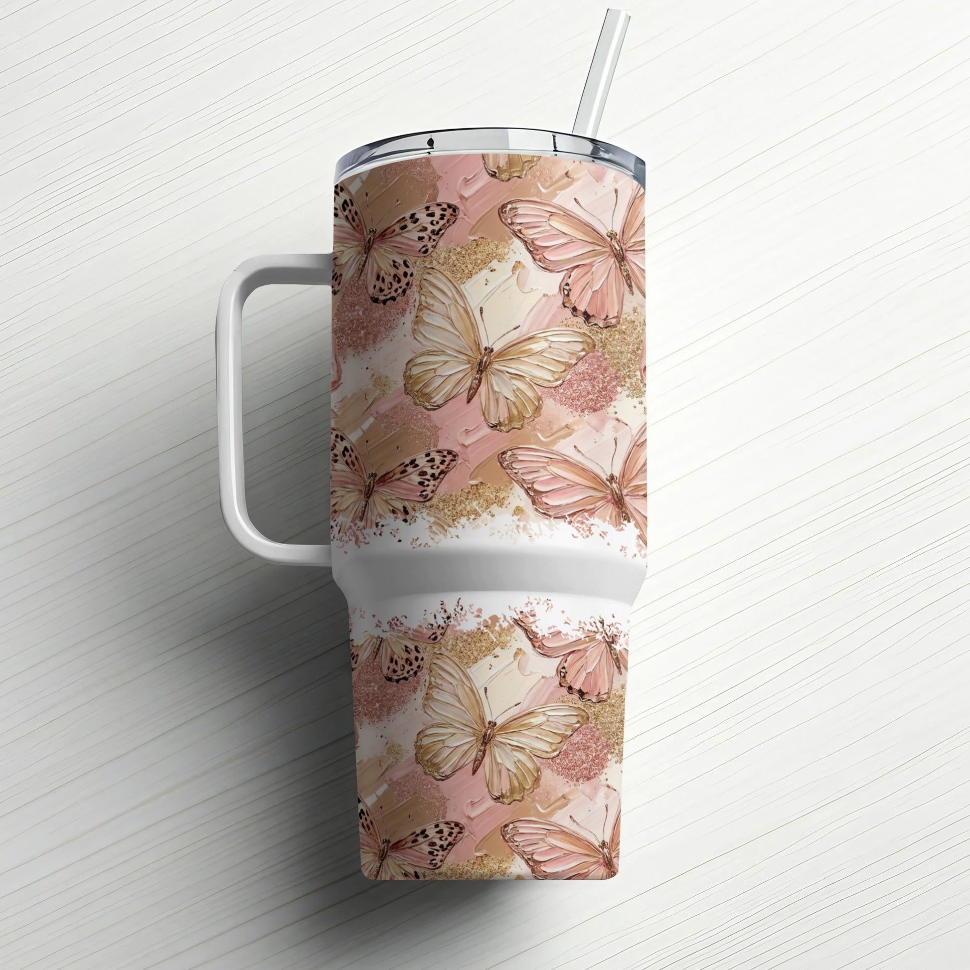 Travel tumbler with pastel butterflies and gold accents.