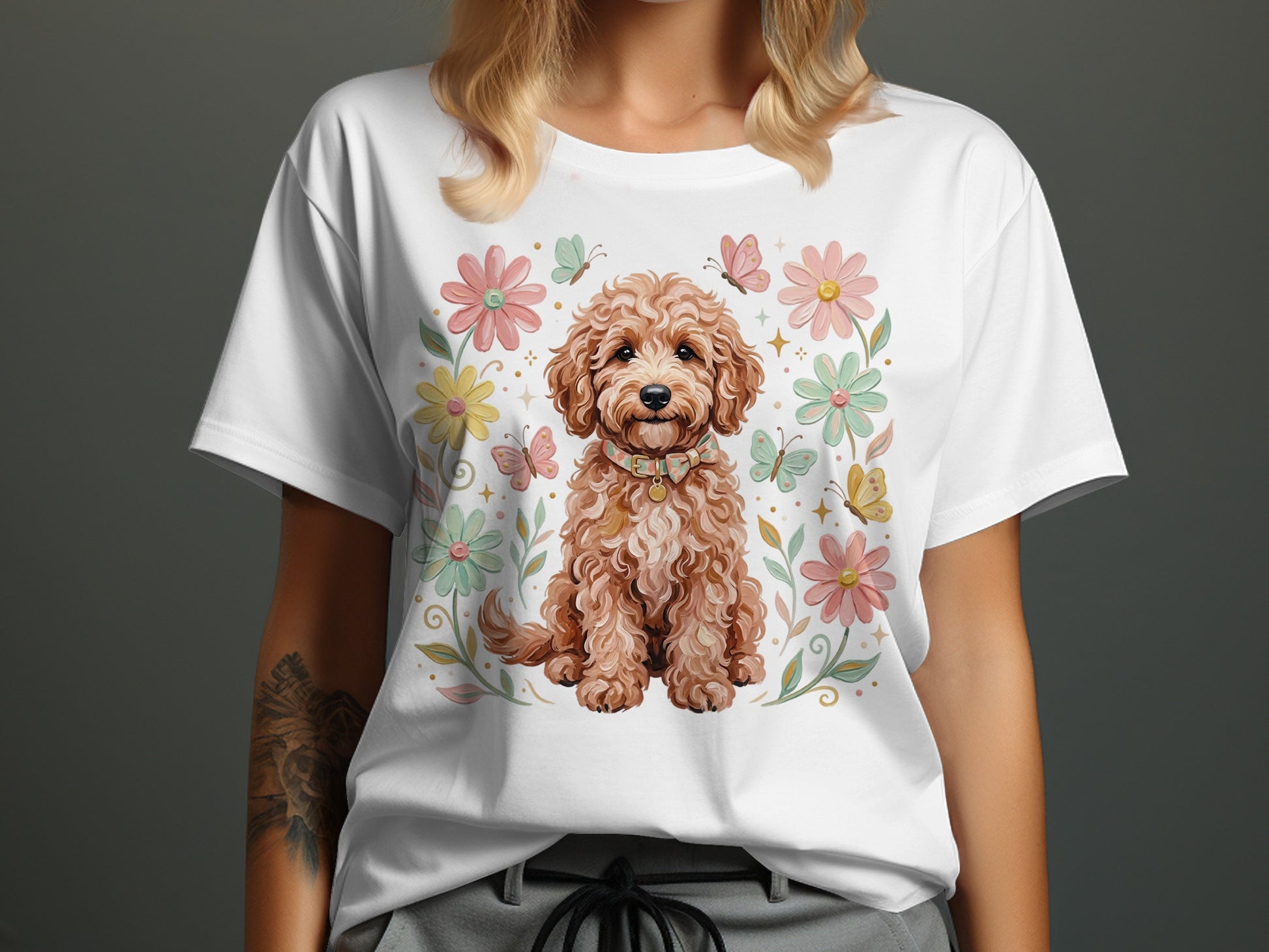 White t-shirt with a cartoon dog surrounded by flowers and butterflies.