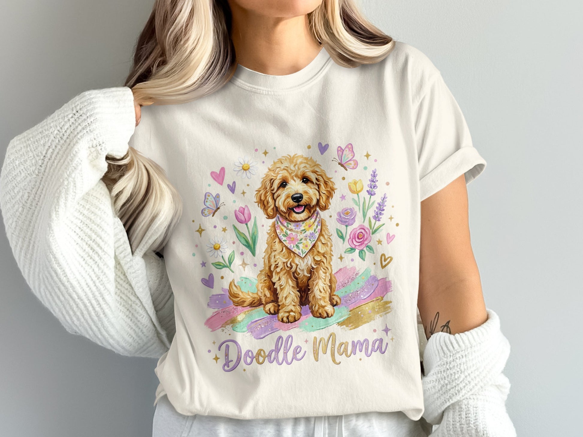 Cream t-shirt with doodle dog, flowers, butterflies, and "Doodle Mama" text.
