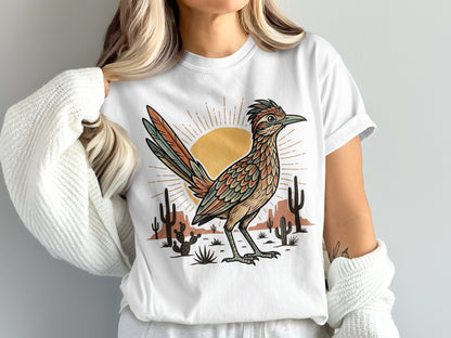 White t-shirt with a stylized roadrunner, cacti, and sun graphic.