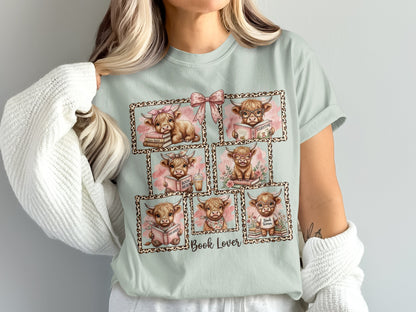Fluffy cows reading books in framed, cute illustrations on a light blue t-shirt.