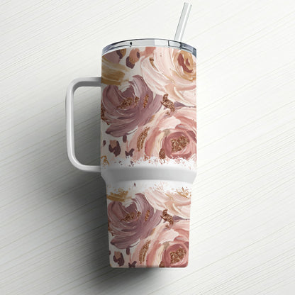 White tumbler with pink and brown floral watercolor pattern and straw.