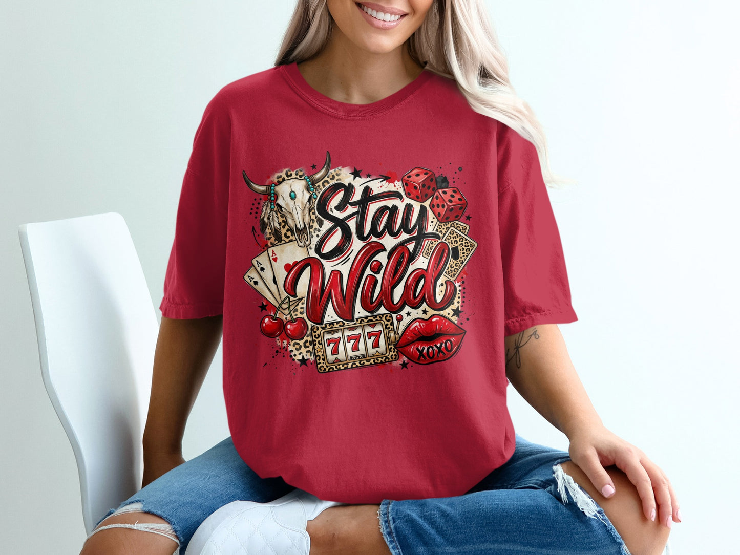 Red t-shirt with "Stay Wild" text, dice, cherries, and poker cards.