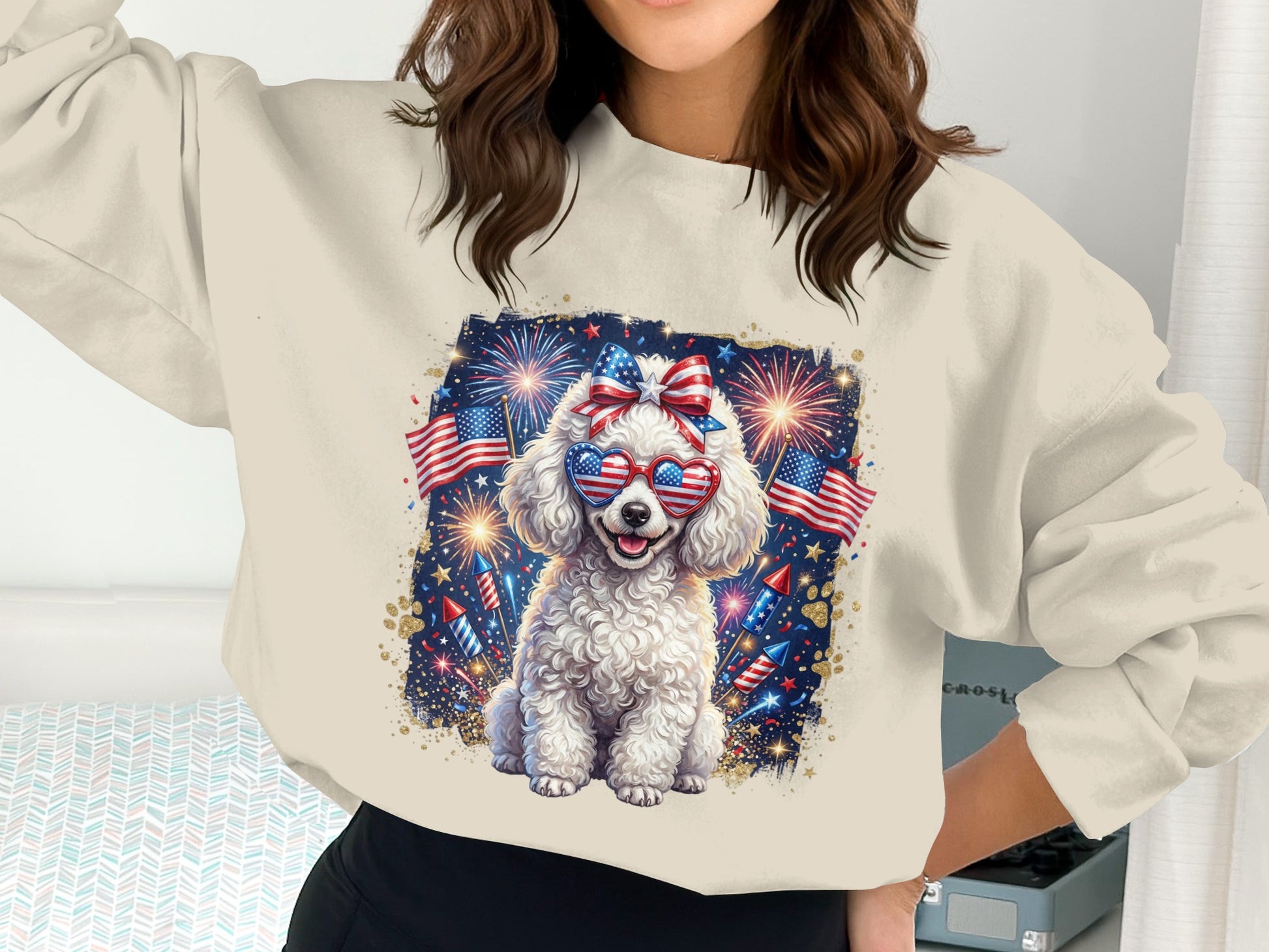 White poodle wearing patriotic sunglasses and bow with fireworks.