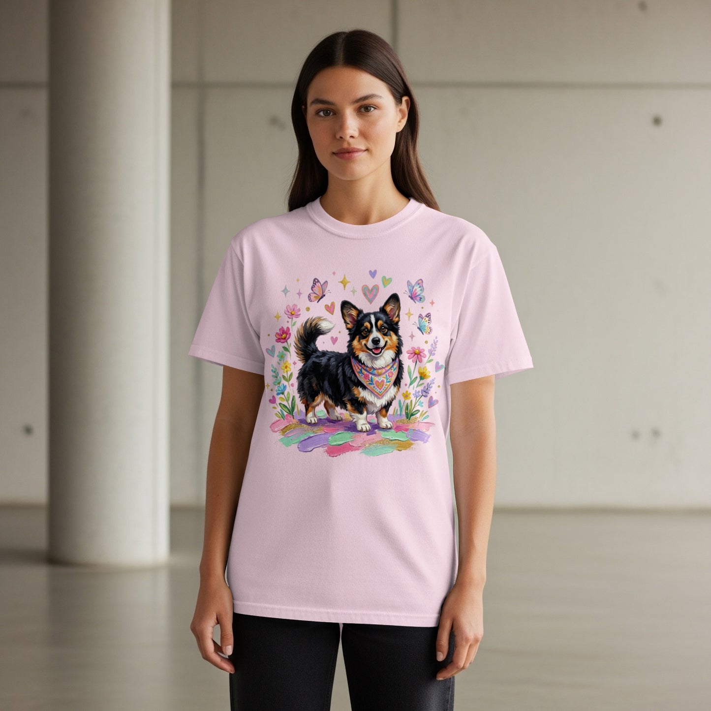 Pink t-shirt with a playful corgi illustration and colorful butterflies and flowers.